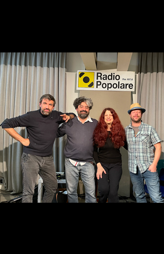 Scarlet with programmers of Radio Populare, Italy.